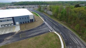 New paved and painted access roads around a warehouse